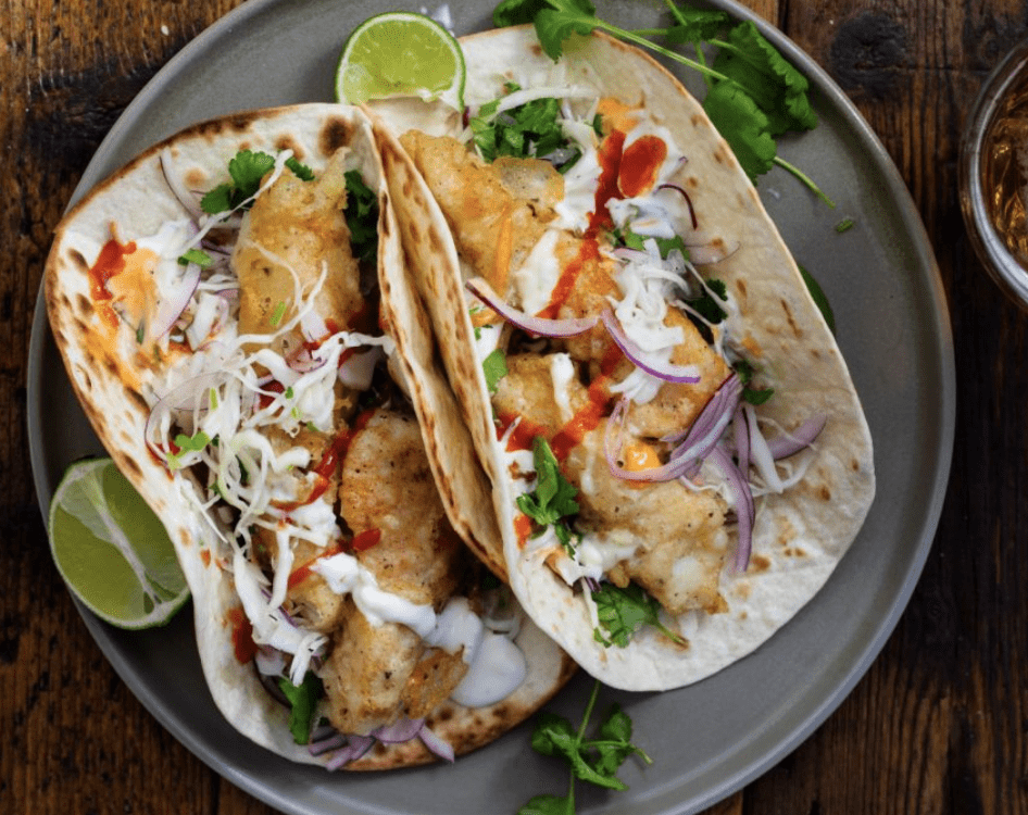 Fish tacos with crispy batter and fresh lime at a Clearwater Beach restaurant