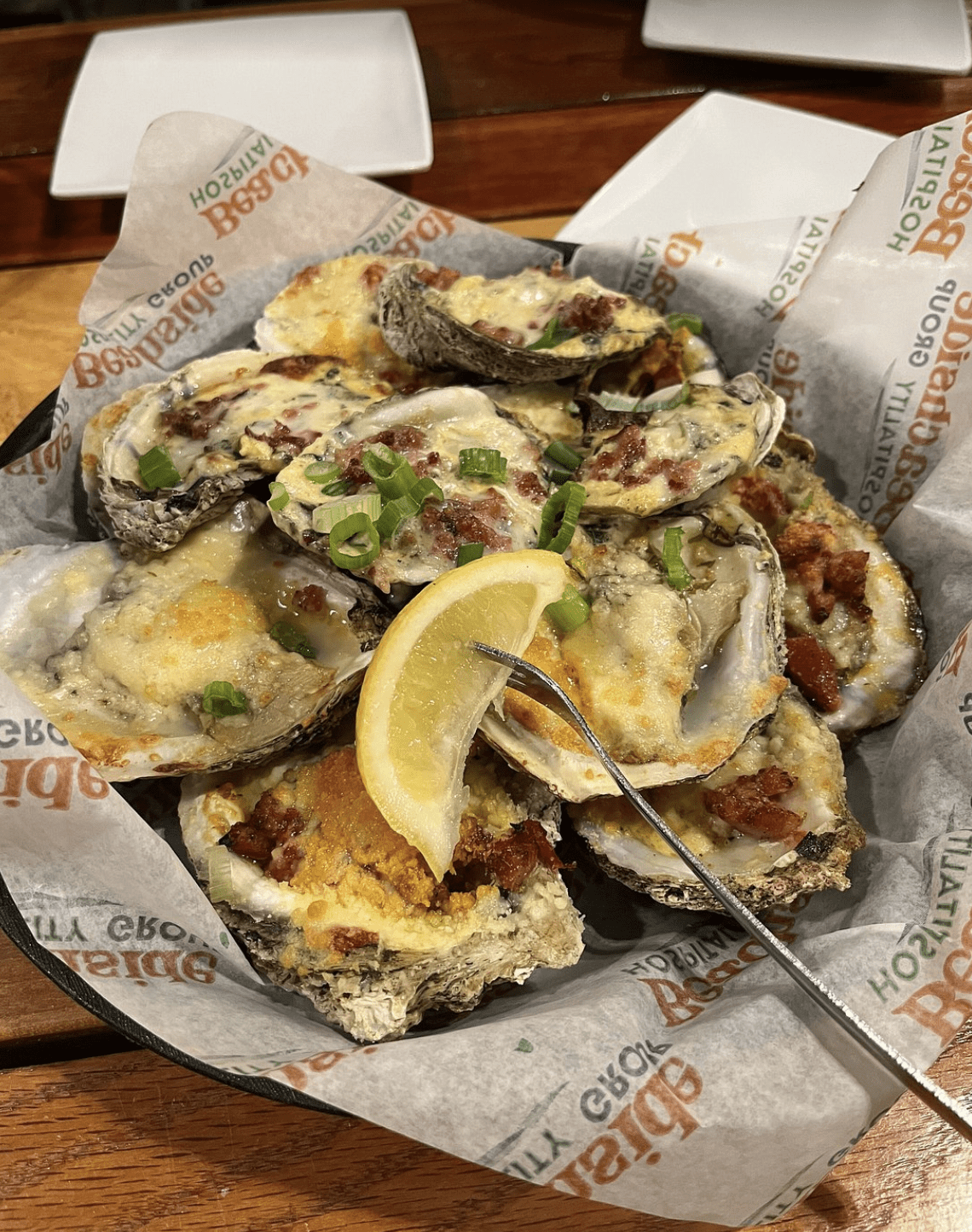 Baked oysters topped with cheese and bacon at a Clearwater Beach seafood restaurant