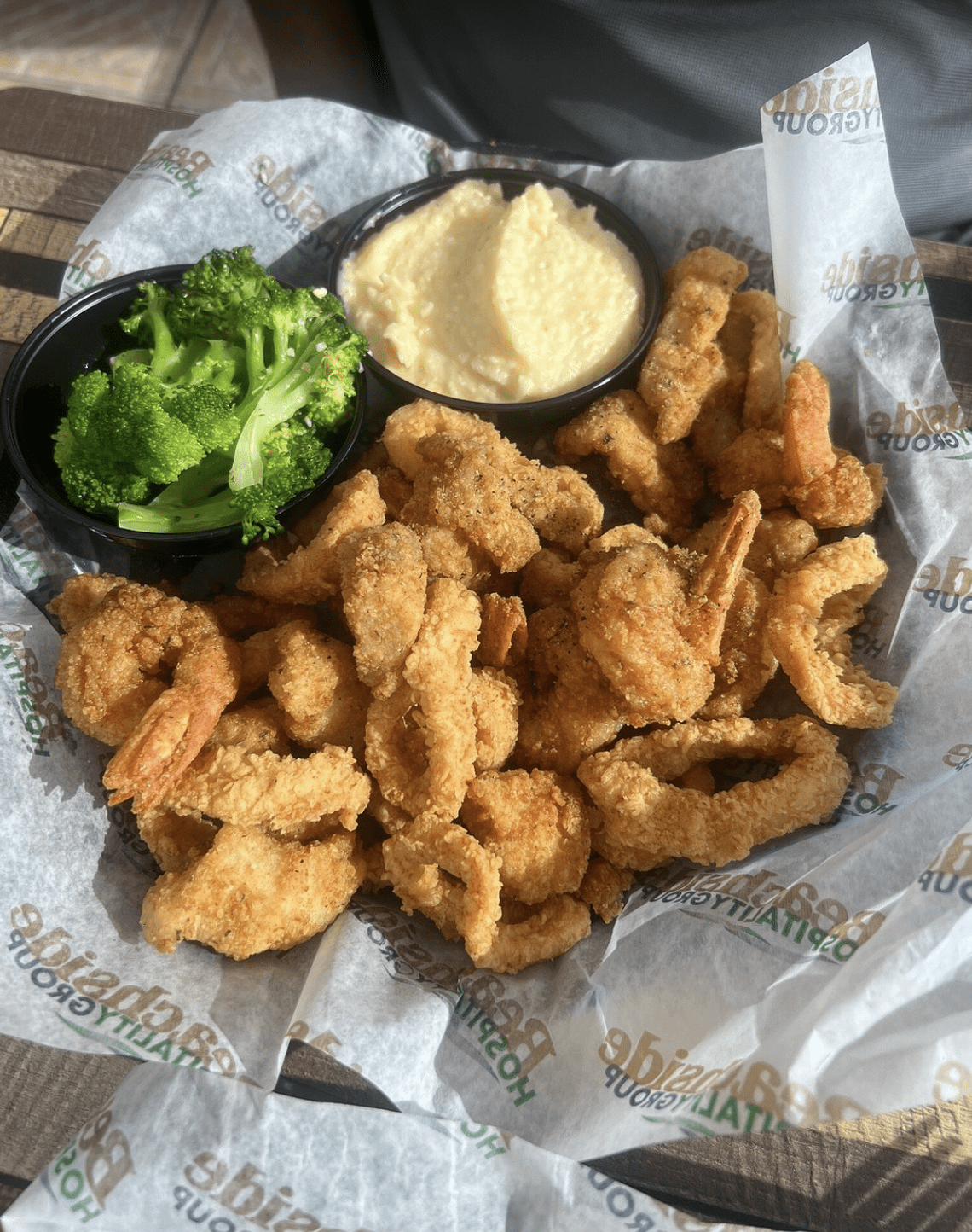 Crispy fried shrimp and calamari served with grits at a Clearwater Beach restaurant