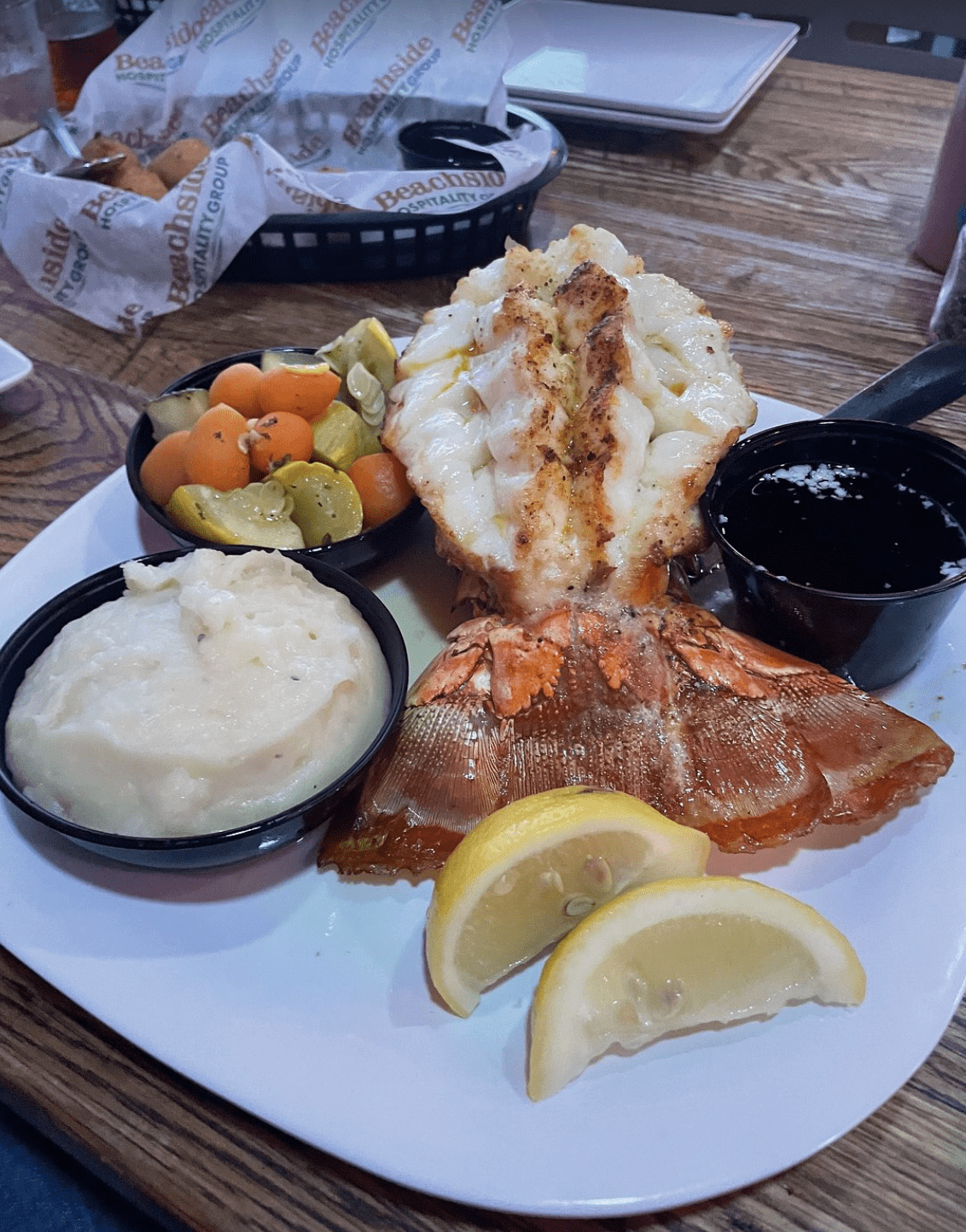 Broiled lobster tail with mashed potatoes and vegetables at a Clearwater Beach restaurant