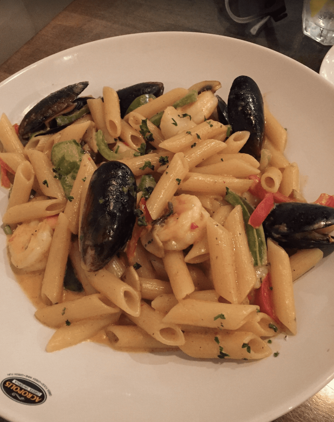 Seafood penne pasta with shrimp, mussels, and peppers in a creamy sauce served in Clearwater Beach.