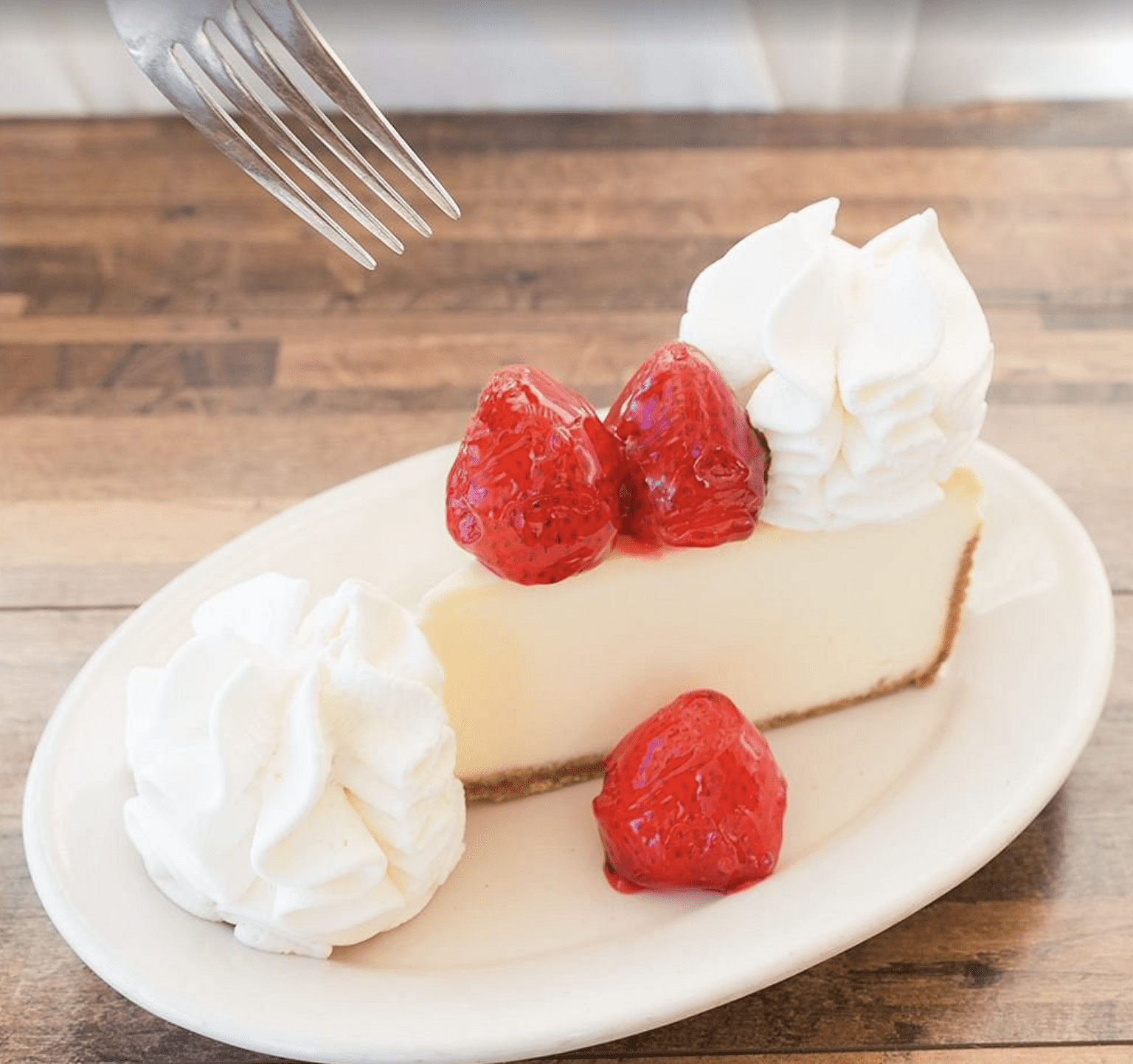 Strawberry cheesecake topped with whipped cream served at a Clearwater Beach café.