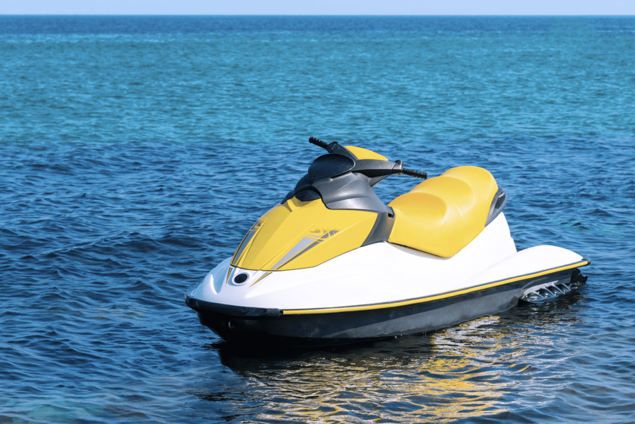 Yellow and white jet ski floating on the blue waters of Clearwater Beach.