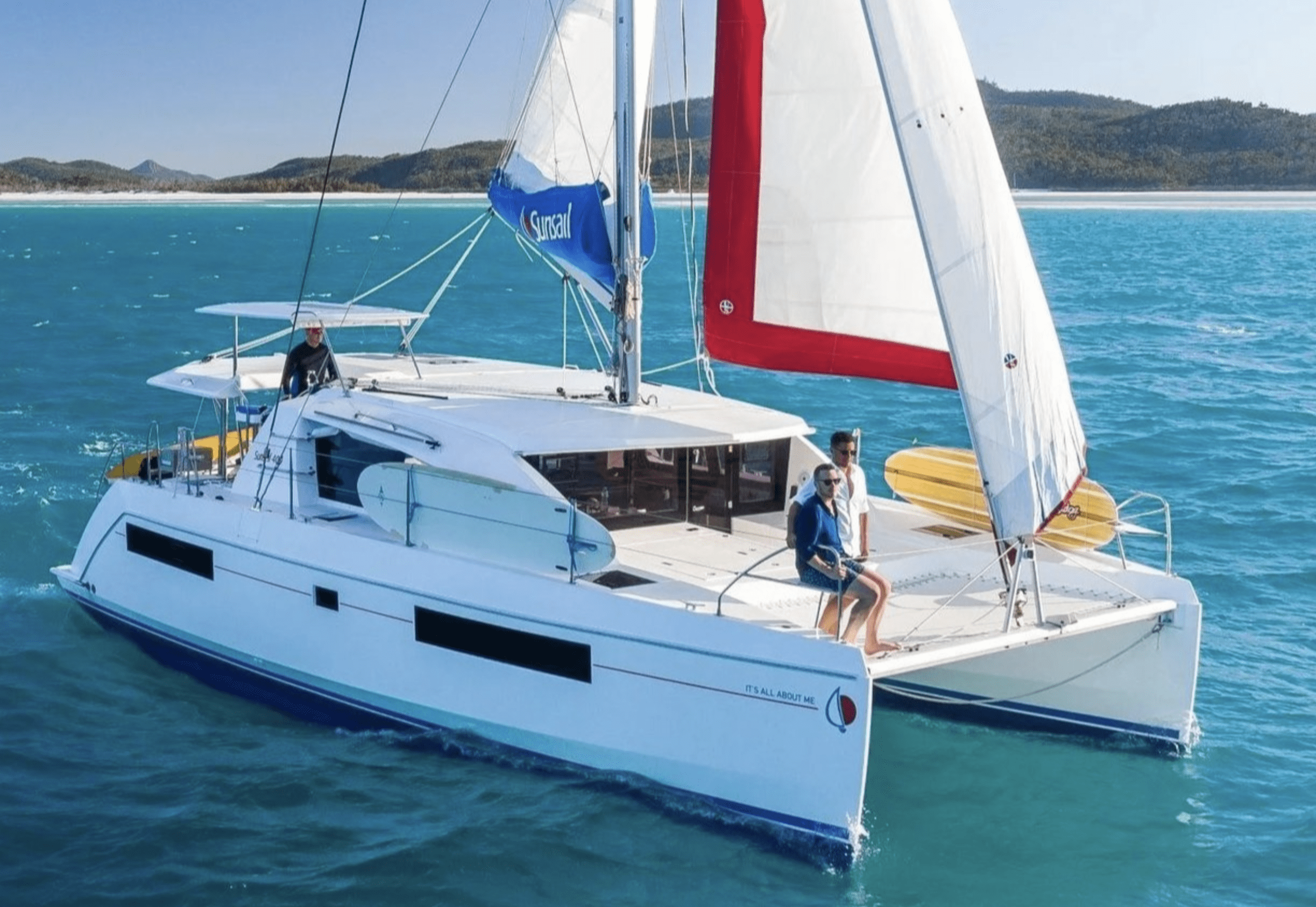 Luxury sailing catamaran cruising the turquoise waters of Clearwater Beach, Florida.
