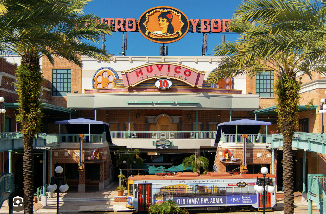Centro Ybor in Tampa with Muvico Theaters and streetcar in front.